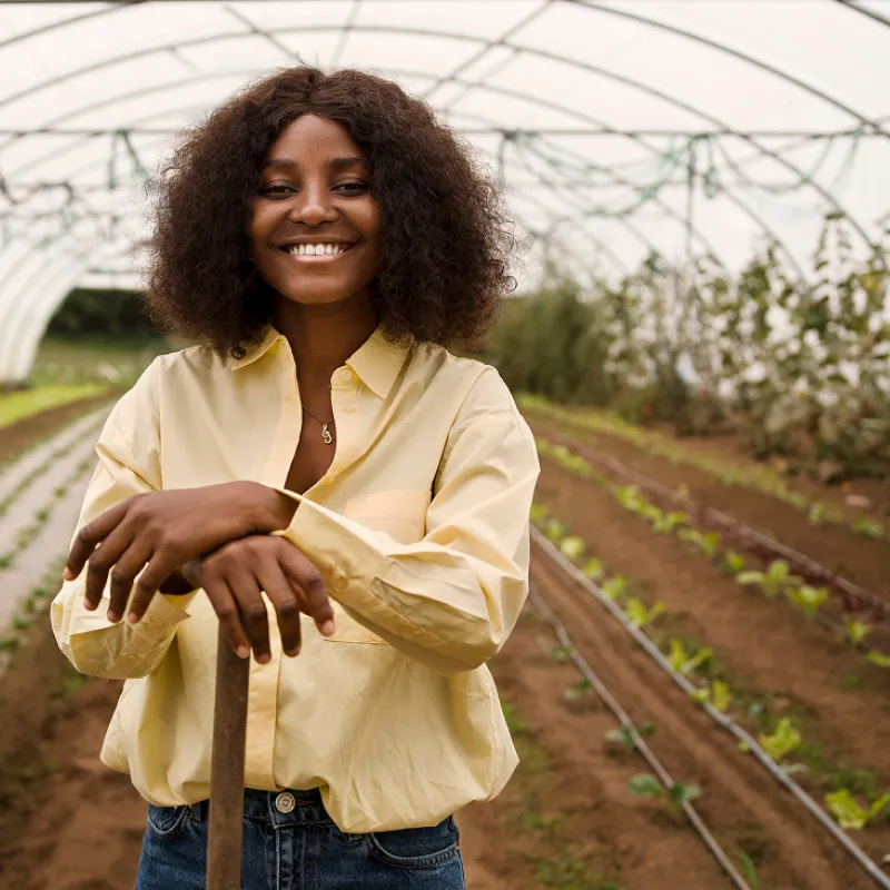 woman gardening in green house