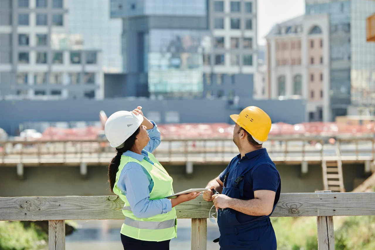 woman and man working at a building construction site