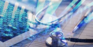 A medical stethoscope resting on a digital surface or tablet that also displays a rising healthcare business graph, symbolizing the connection between medical service quality and financial growth.
