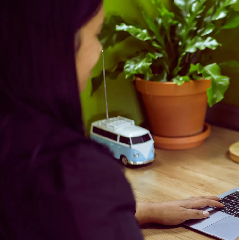 woman sitting at her desk working on her laptop