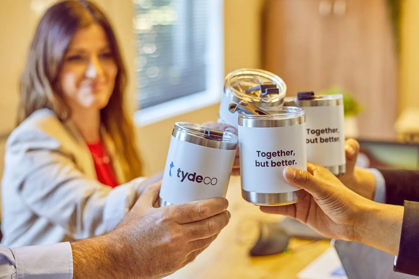 staff members holding cups with sayings on it.