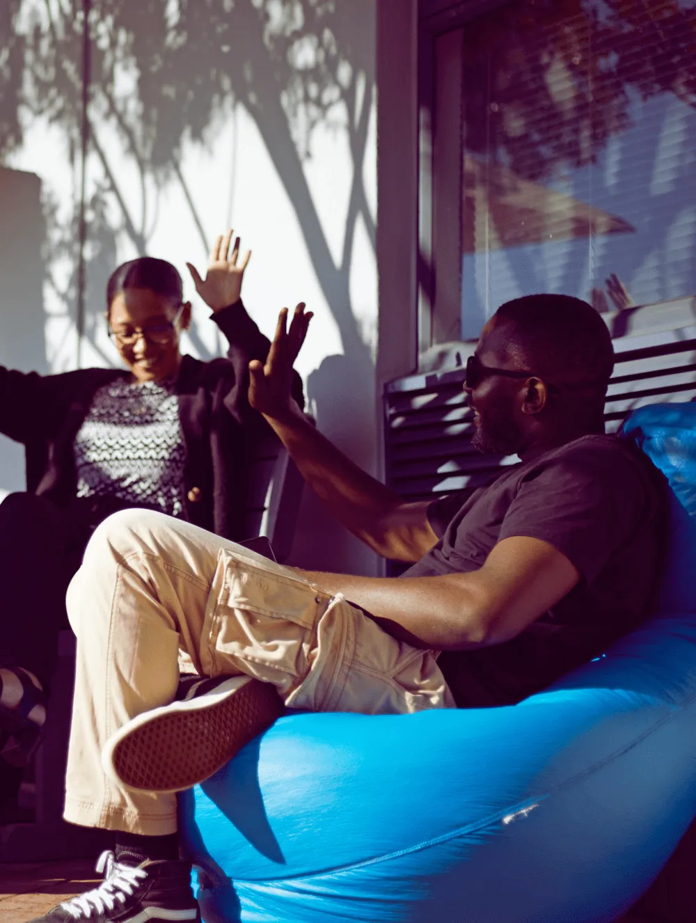 woman and man sitting relaxing out side in the sun